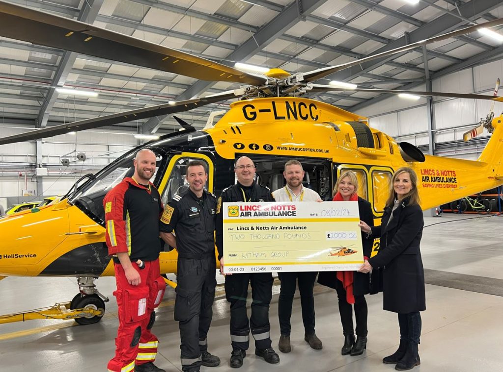 The Witham Team presenting a fundraising cheque for £2,000 to the Lincs & Notts Air Ambulance crew