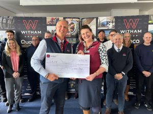 Nigel Bottom presenting a cheque to Emma Billings, LRSN